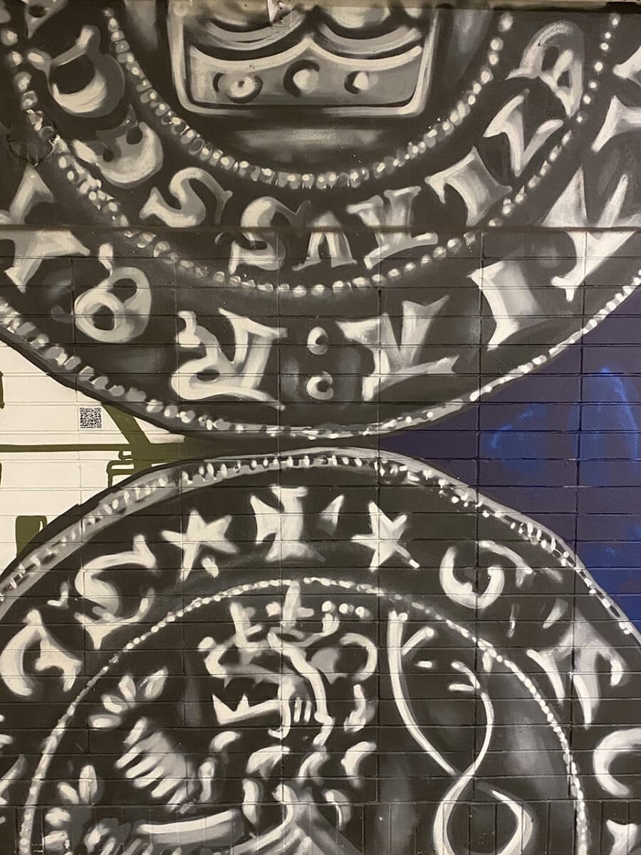 Kutná Hora street art, featuring medieval kings, coins and famous composers.