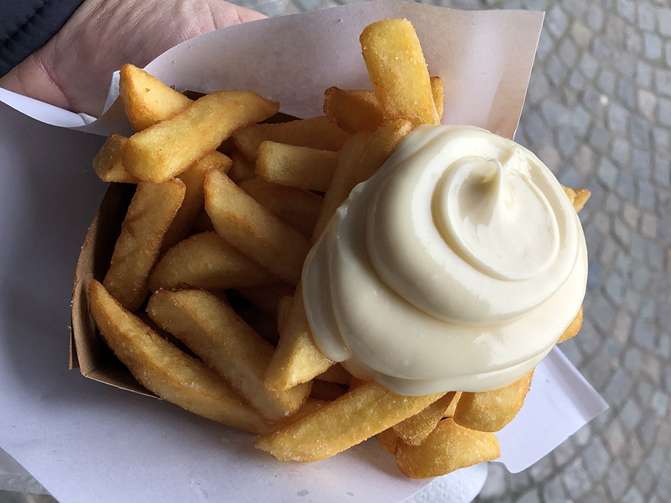 Hot, fresh, delicious Belgian fries with mayonnaise in Bruges.