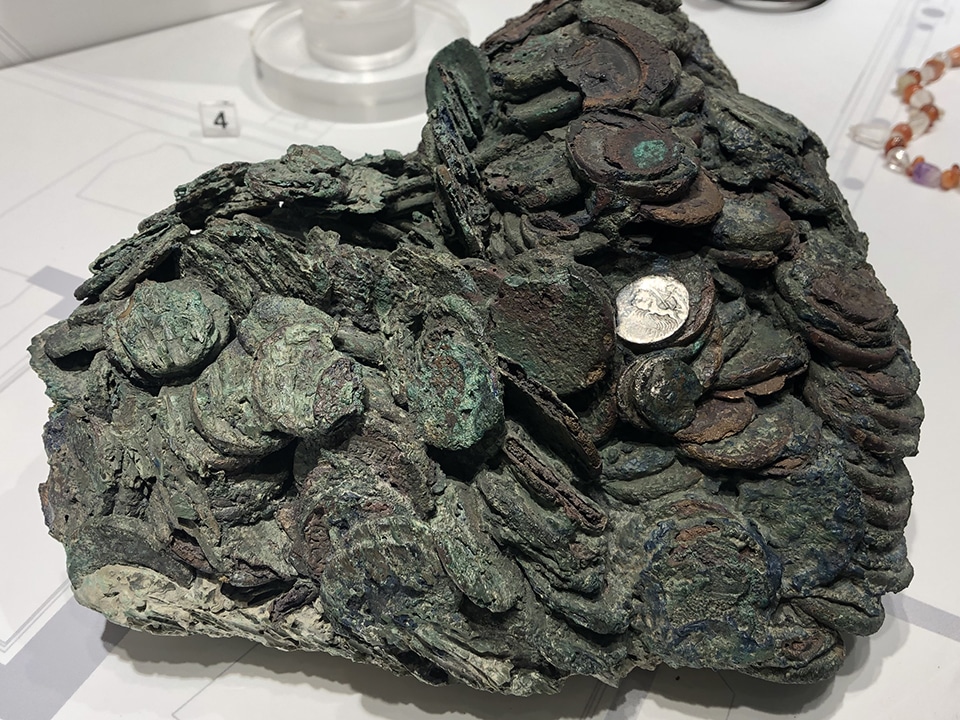 A hoard of Roman coins, fused together because of volcanic heat.