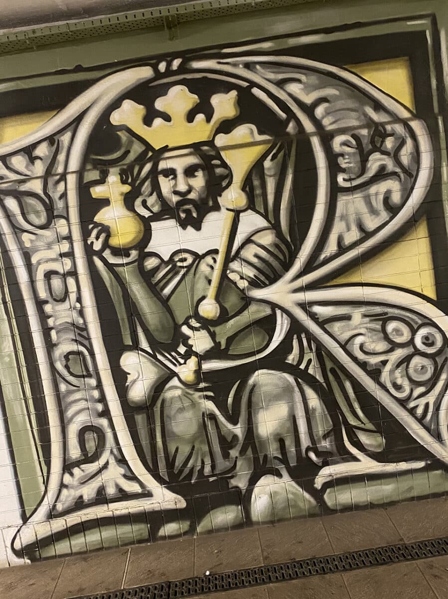 Kutná Hora street art, featuring medieval kings, coins and famous composers.