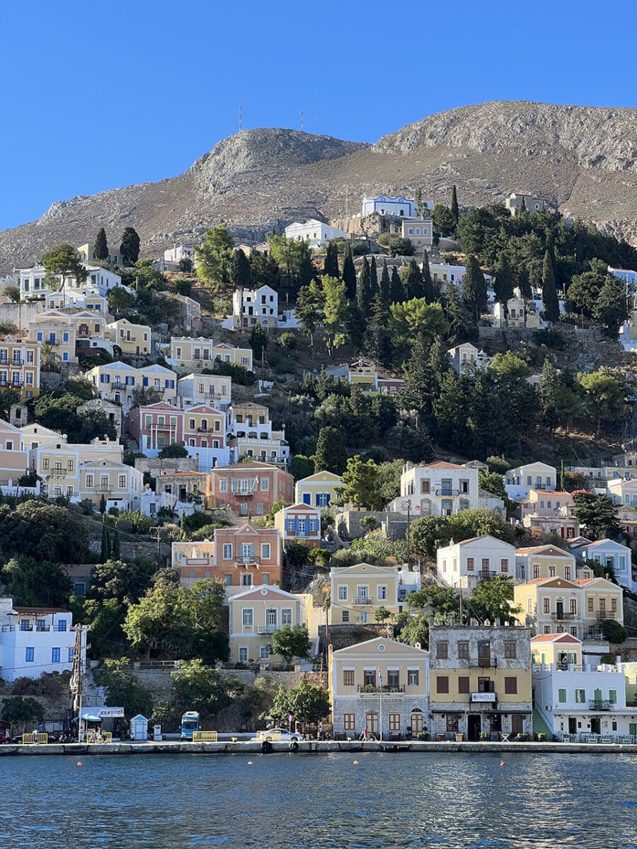 The colourful hillside buildings of Symi, Greece.
